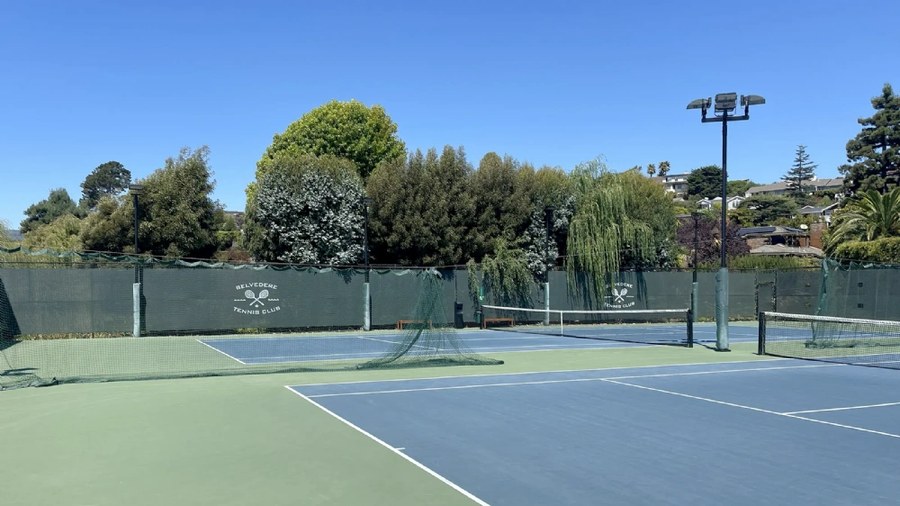 Hillside court lighting with tight spill limits: Belvedere Tennis Club