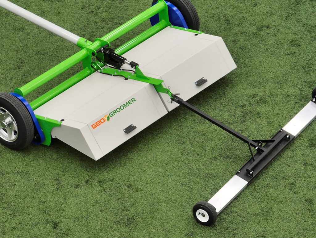 GeoGroomer turf groomer with magnet on a synthetic field