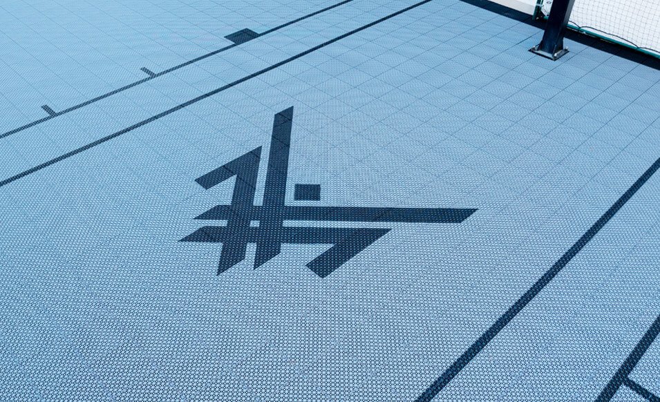 A custom backyard half-court in team colors: Maxx Crosby