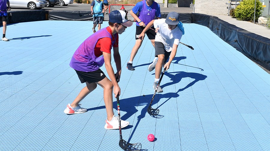 A portable ball hockey court that travels with the school: Gretzky Hockey School